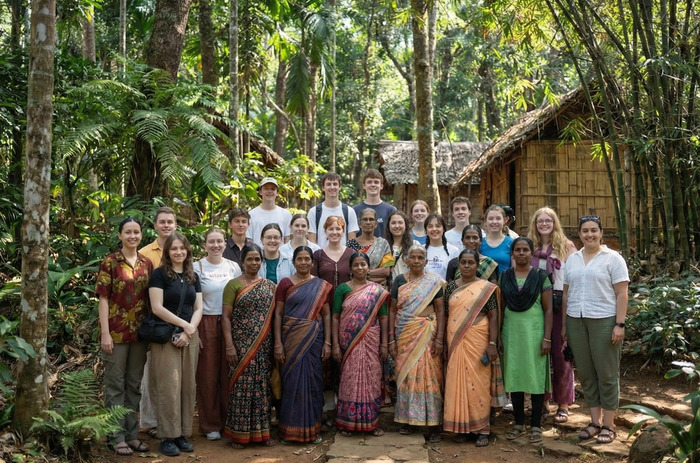 Artisans selling their crafts at a local market stall.