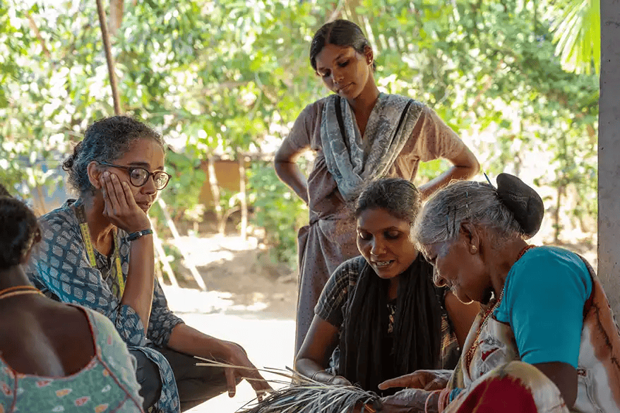 Diverse group of people from Indian tribal communities smiling.