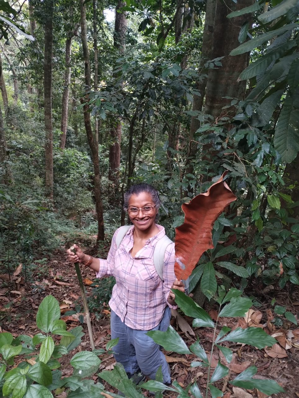 Portrait of Preetha Mathews, curator of Blue Lotus, smiling warmly.