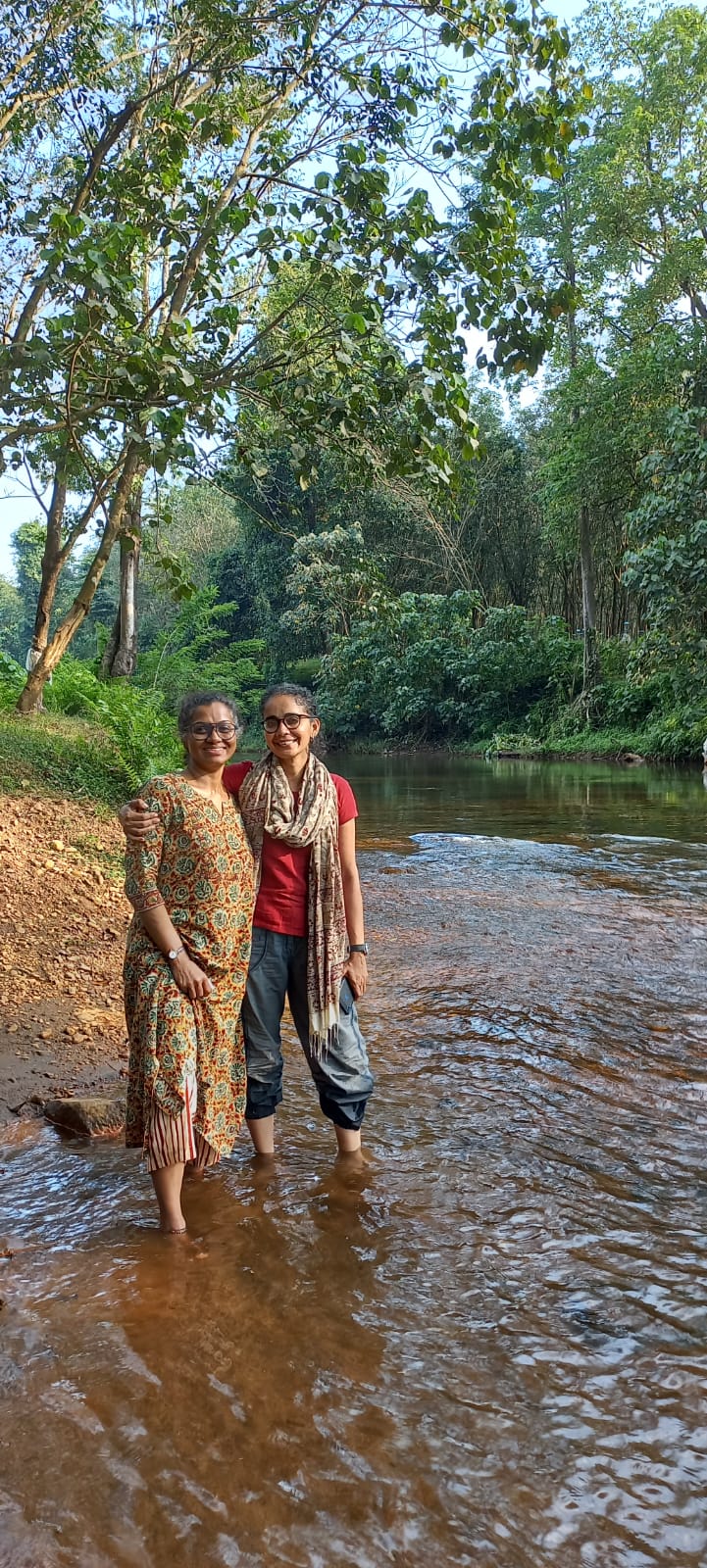 Women from the Forest Post community crafting handmade goods in a sunlit workshop.