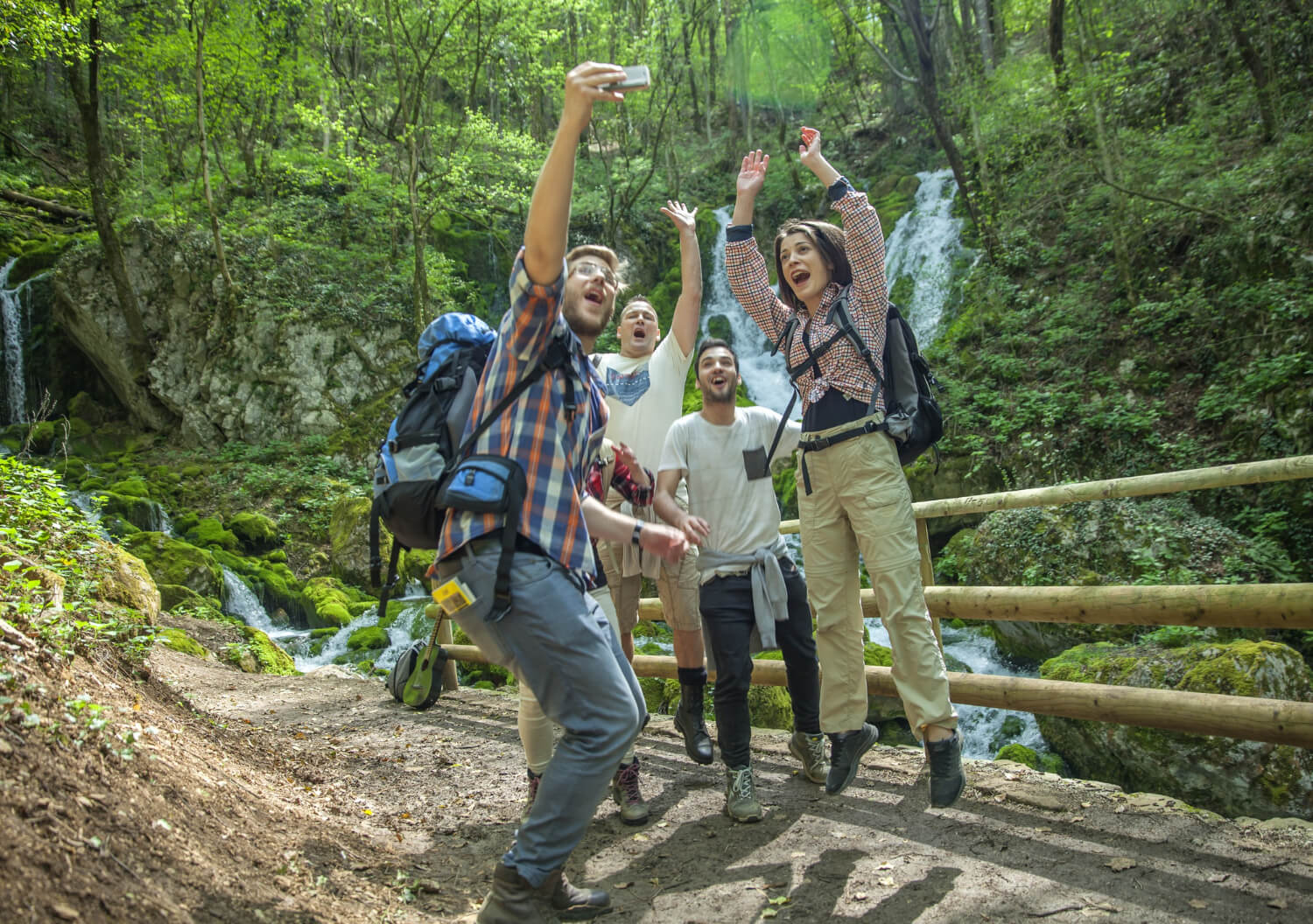 A diverse group of happy participants engaging in a moderate activity outdoors in Kerala.